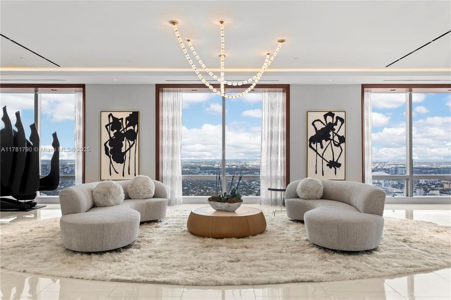 Welcome to the sky! On the 70th floor, this nearly 6,000 SF penthouse, designed by Jonathan A Ragusa, unites three units into an extraordinary residence. Breathtaking views of the ocean, skyline, and city set the stage for this impeccable home. Rich in detail, it boasts Cristallo stone, Italian Italcraft cabinetry, and a chef’s kitchen with Wolf and Sub-Zero appliances. Handcrafted Venetian glass light fixtures, bespoke European furnishings, and curated art enhance the interior’s timeless elegance. Smart home automation with Josh AI and Alisse switches seamlessly controls lighting, sound, and shades. Two expansive living areas, a spa-like primary suite, private entry, 4 parking spaces, and 6 Equinox memberships complete this rare and exceptional offering.