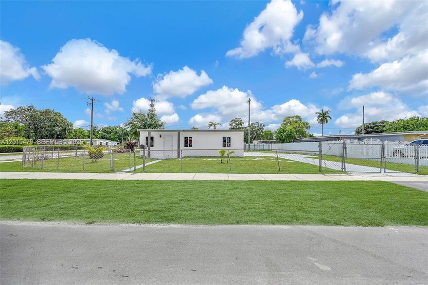 Fully renovated modern home situated on a spacious oversized corner lot with ample parking and fully fenced yard. This move-in ready property features a bright open layout with sleek contemporary finishes throughout, including a designer kitchen with custom cabinetry, quartz-style countertops, modern backsplash, and stainless-steel appliances. The beautifully updated bathroom showcases floor-to-ceiling marble-look tile and a luxury rainfall shower system.

Enjoy updated flooring, fresh interior and exterior paint, impact-style windows, recessed lighting, and a clean minimalist design that gives the home a modern feel. Expansive front and side yards offer plenty of space for entertaining, parking boats/RVs, or future outdoor additions. Conveniently located near major highways, shopping, dining, and schools.