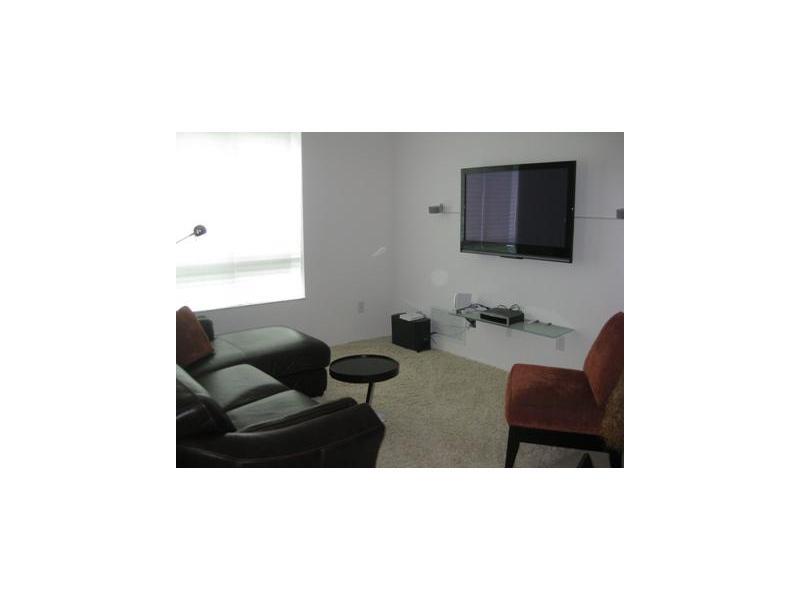 Largest corner 1 bedroom with den (16 x 11.5 feet) could be second bedroom. No closet. Lots of natural light flows in. Balcony off den and living room. Faces North. European kitchen w/ granite counters. Washer & dryer in apt. Tile in living area. Carpet i n den and bedroom. Excellent condition. Amenities include: assigned parking, valet, fitness center on 4th floor, wi fi hot spots, concierge, underground parking. Walking distance to Downtown Dadeland.