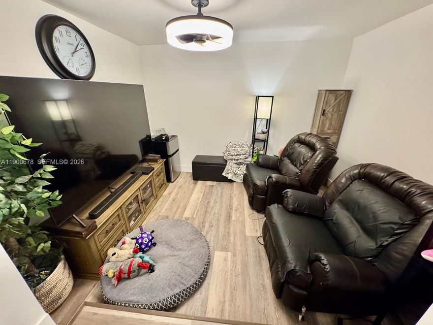 Great opportunity on large, oversized lot! Charming 3-bedroom, 1-bath home with a separate rear unit currently used for storage, offering endless possibilities. Set on a generous 10,500 sq ft lot at the end of a quiet cul-de-sac. Inside, natural light fills every corner, highlighting high ceilings, new baseboards, and freshly updated finishes. The kitchen features white cabinets, butcher block counters, a wall and standard oven, stainless gas stove, and double sink. Key highlights include impact windows plus accordion shutters, approx 8 yr old roof, 2022 A/C, and gas water heater. The screened porch overlooks a huge backyard with mature trees, including a mango tree. Additional perks include a spacious laundry room/pantry and transferrable PACE energy-efficient upgrades.