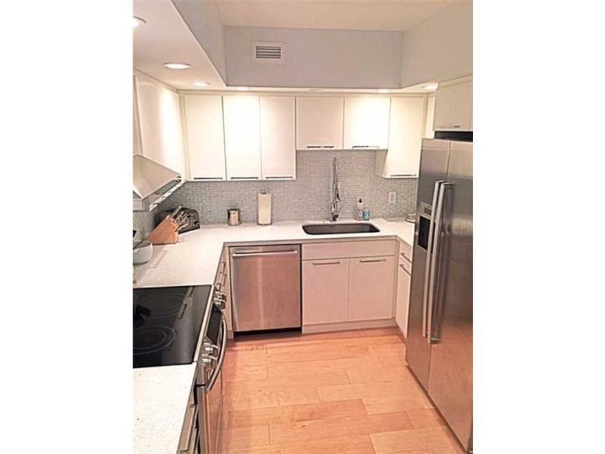 Easy to show. Direct water view of intra coastal, bay and islands. Immaculate gut renovated unit with real birch wood floors. Bosch appliances including washer and dryer. White wedge wood cabinets, quartz countertops in kitchen and bathrooms. Walk to the  beach. Offered furnished or unfurnished. Very well run building. Brand new million dollar pool renovation just completed, A must see.