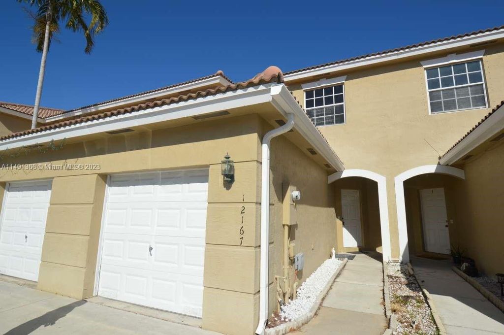 Photo of 12167 SW 4th St #12167, Pembroke Pines, FL 33025 (MLS # A11491368)