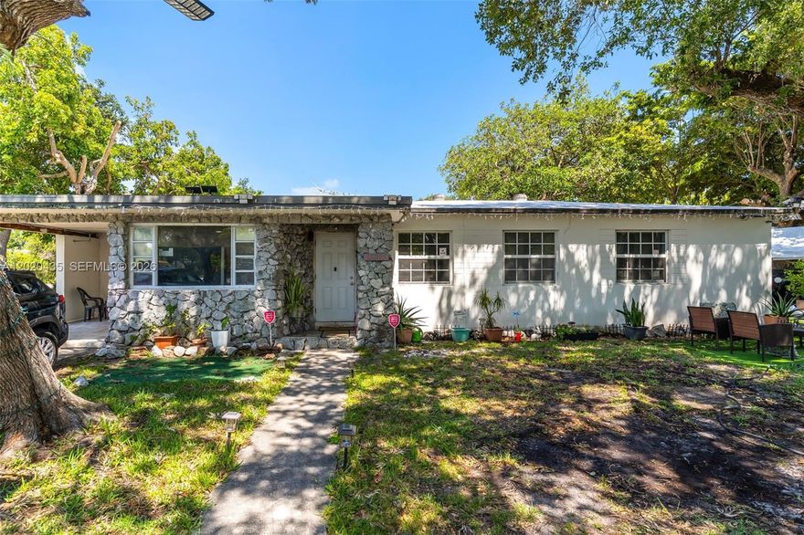 Charming single-story home situated on a spacious corner lot with beautiful mature trees, plenty of parking, and inviting outdoor living areas. From the stone-accented front façade to the shaded yard, this property offers great curb appeal and a warm, comfortable feel. Inside, you’ll find updated flooring, recessed lighting, bright white walls, and a cozy living area that flows into the kitchen. The kitchen features white cabinetry, stainless steel appliances, granite-style countertops, decorative backsplash, and excellent storage space. A separate dining area with exposed wood beam ceilings adds character and charm, creating the perfect spot for meals, gatherings, or entertaining. The bedrooms are comfortable and filled with natural light, offering flexibility for family, guests, or a home office. The updated bathroom includes modern tile finishes and a walk-in shower. The home also offers an interior laundry/storage area for added convenience. Outside, enjoy a private backyard/patio with artificial turf, covered canopy space, seating areas, and room for gardening, relaxing, or entertaining. A great opportunity for buyers looking for charm, comfort, and usable outdoor space.