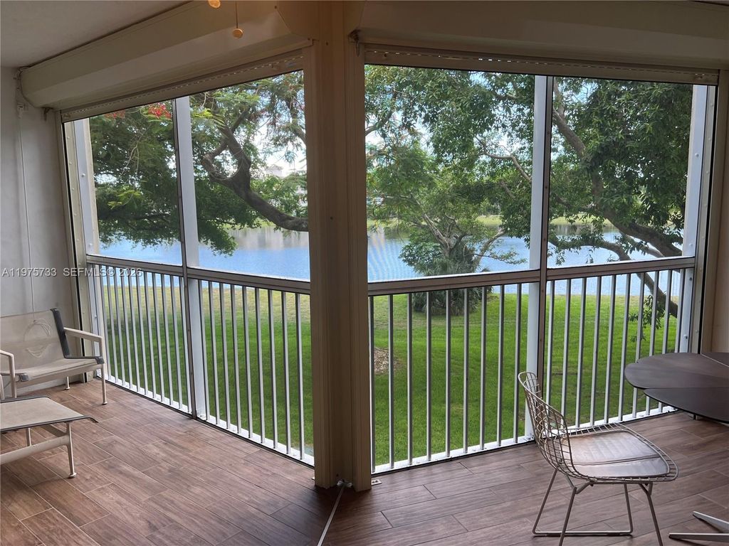 Photo of 2940 N Course Dr #305, Pompano Beach, FL 33069 (MLS # A11975733)