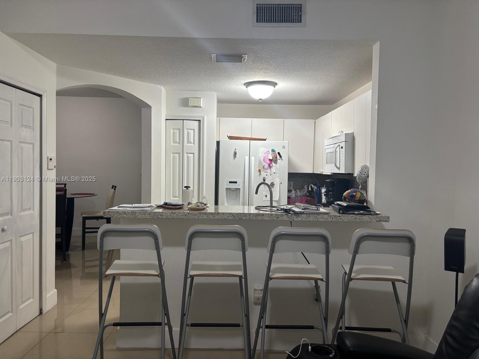 THE GATES AT DORAL ISLES - Residential Lease