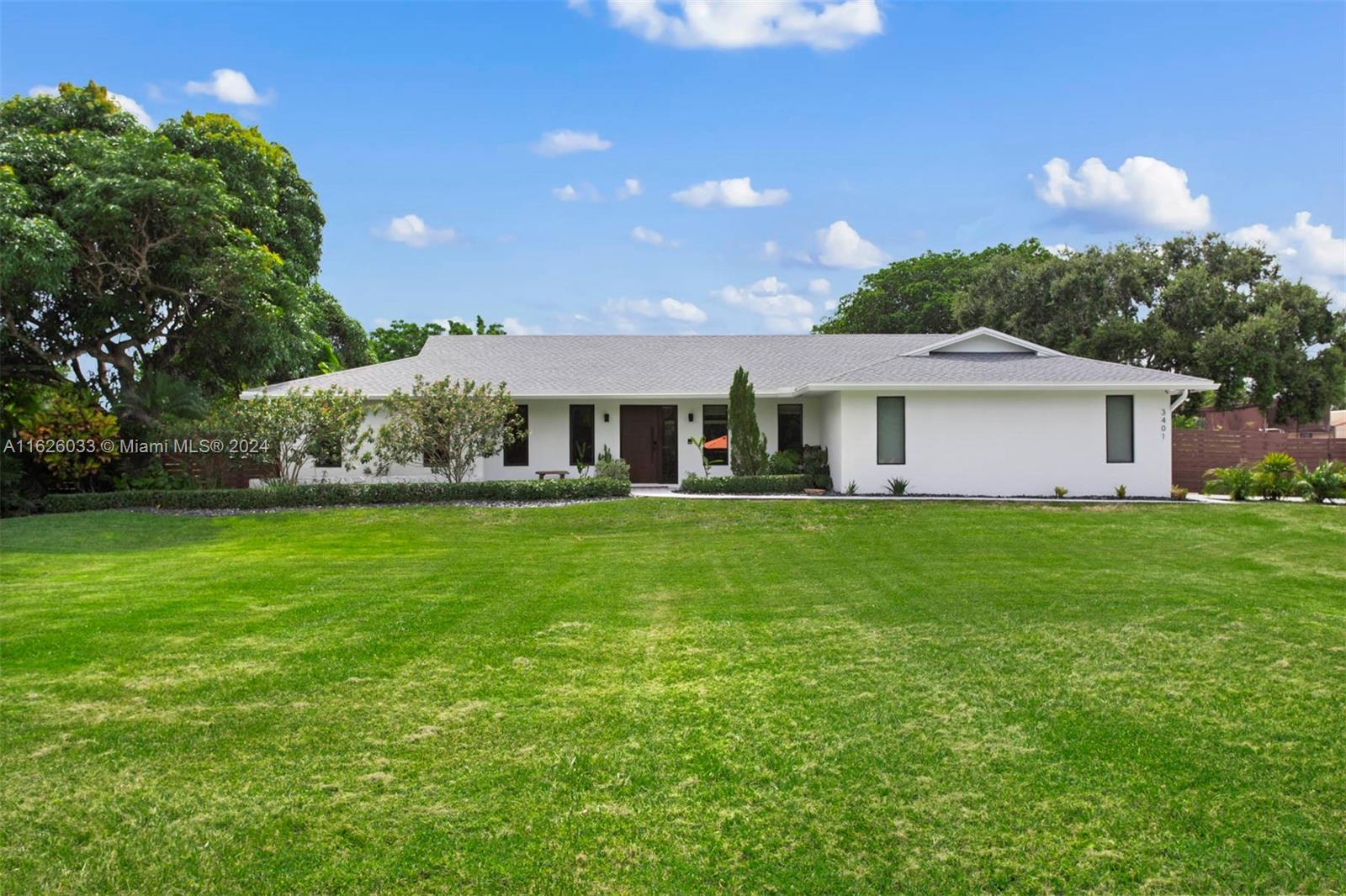 Discover true peace in Majestic Groves, an exclusive community with no HOA. This updated gem on a 46,194 SF lot boasts a tennis court, garage, saltwater heated pool, rare mature fruit trees, and canal-side privacy. Inside, indulge in premium finishes and smart-home technology that elevates your experience, ensuring more convenience, safety, and enjoyment. Integrated speakers and lighting enhance the atmosphere, enabling you to effortlessly create any ambiance you desire. The kitchen is adorned with custom Italian cabinetry crafted with some of the most durable and long-lasting materials on the market featuring Bosch appliances, a Sub-Zero fridge, and ample storage. Other valuable features throughout are best appreciated in person. Schedule a showing to see if this feels like home to you.