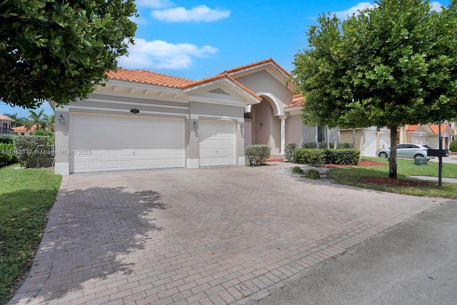 This elegant home offers 4 bedrooms, 4 and 1/2 bathrooms, and a 3-car garage. 12-foot ceilings. The interior and exterior have been freshly painted, and new contemporary light fixtures accentuate the open floor plan. The gourmet kitchen features stainless-steel appliances, double ovens, and abundant cabinet space. The master suite boasts an oversized walk-in closet and a spa-inspired bathroom with dual vanities, marble flooring, and a Jacuzzi tub. Rent includes: 24/7 guardhouse and security patrol, cable TV, monitored alarm, high-speed internet, and full access to the community clubhouse, which includes a fitness center, heated pool, playground, tennis, and basketball courts. Experience resort-style living to show.