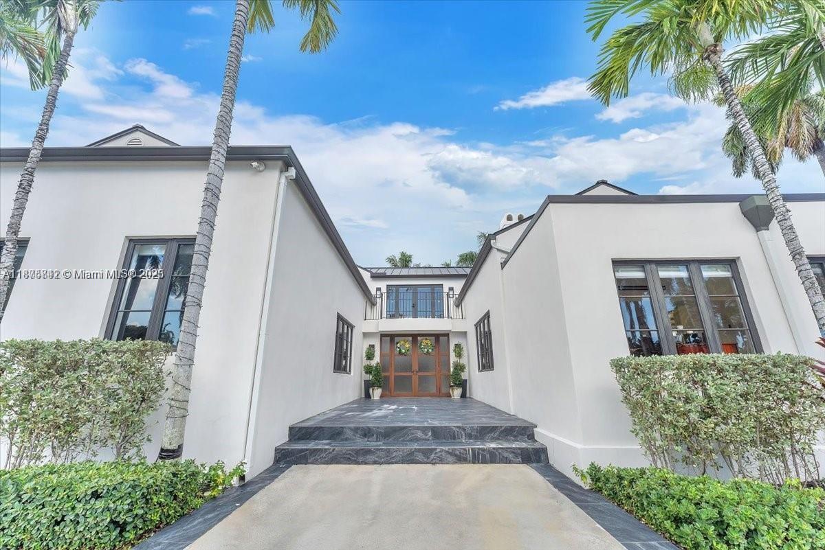 BEAUTIFULL HOUSE READY TO MOVE IN located on one of the nicest streets in Hollywood Lakes, 5 bedrooms/3 baths/2 half baths. Sun-filled interior with stunning finishes throughout the residence. Inviting living, family, dining, recreation room and modern kitchen. Volume ceilings with exposed wood beams. Two Primary bedrooms one downstairs leading to pool area while the upstairs has a beautiful balcony. Primary baths have separate soaking tub and glass door shower. Over 15,000 sq ft lot with a gorgeous freeform pool, putting green, full outdoor kitchen area, sitting area, and beautiful yard. Wall around entire property with two electric gates at front of home and one through alley way. Spacious laundry room. Full size generator. Both sophisticated and elegant.