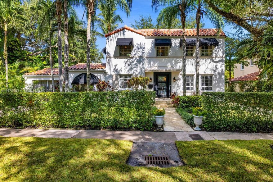 Nestled 2 blks from Coral Gables Country Club & Golf Course, this 5 BR, 4 BA home is a haven of luxury & tranquility, with Mediterranean elegance & modern comfort. The main house hosts 4 beds, 2 updated baths, living room with fireplace, dining room, family room with vaulted ceiling, and an inviting screened-in veranda. The renovated kitchen features Wolf oven & cooktop & exposed wood-beamed ceilings. The 2,553 Adj SF property includes a separate, charming guest house, w/ 1 BR overlooking pool, 1 BA, a living area, & kitchenette above studio/gym area with a cabana bath & laundry. Stunning double lot spans 14,301 SF & is surrounded by palms, lush tropical gardens, multiple patio areas, large pool, & green space- a backyard oasis! Bask in the sun or host al fresco dinners under the stars!