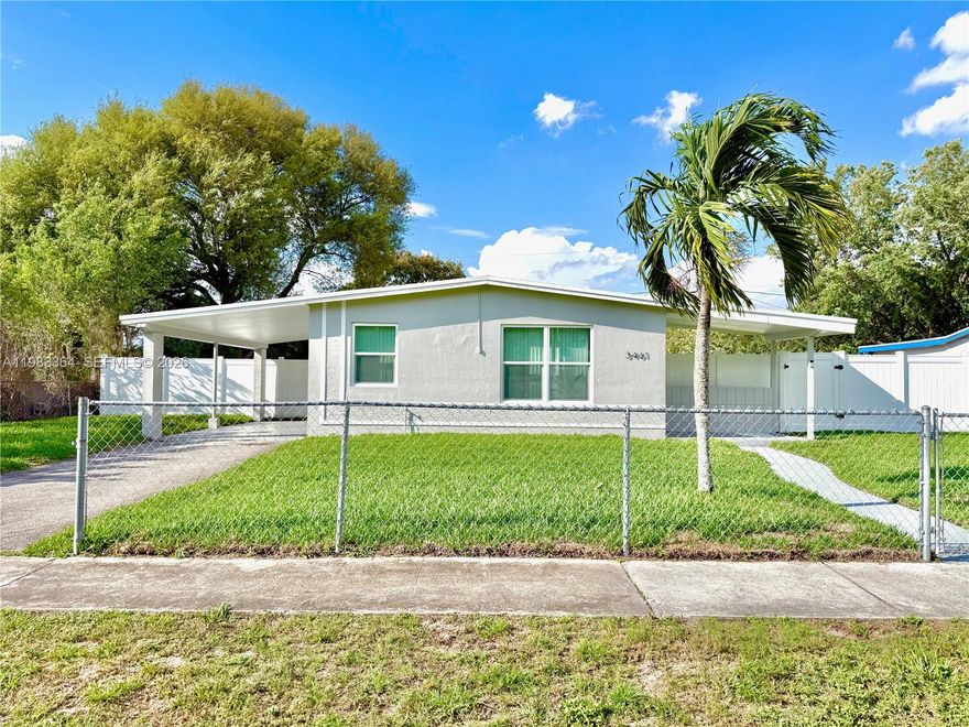 Experience ultimate peace of mind in this centrally located, fully renovated Lauderhill single-family home featuring impact windows and doors throughout for maximum security and insurance savings. This stunning 3-bedroom, 2-bathroom residence offers a 2023 roof, newer AC, and newer water heater, ensuring years of worry-free living with NO HOA! The interior is bathed in natural light and features luxury scratch-proof and waterproof vinyl flooring throughout, an en-suite bedroom, fresh paint inside and out, and high-end porcelain tile in the bathrooms, which offer both a walk-in shower and a soaking tub. The kitchen boasts white cabinetry, new stainless steel appliances, 2 pantries, and quartz countertops with a giant counter area designed for seating. Modern conveniences continue with a new front-loading washer and dryer. The exterior is equally impressive, featuring a covered carport and a massive, fully fenced front and back yard equipped with a full sprinkler system for ultimate privacy and curb appeal.