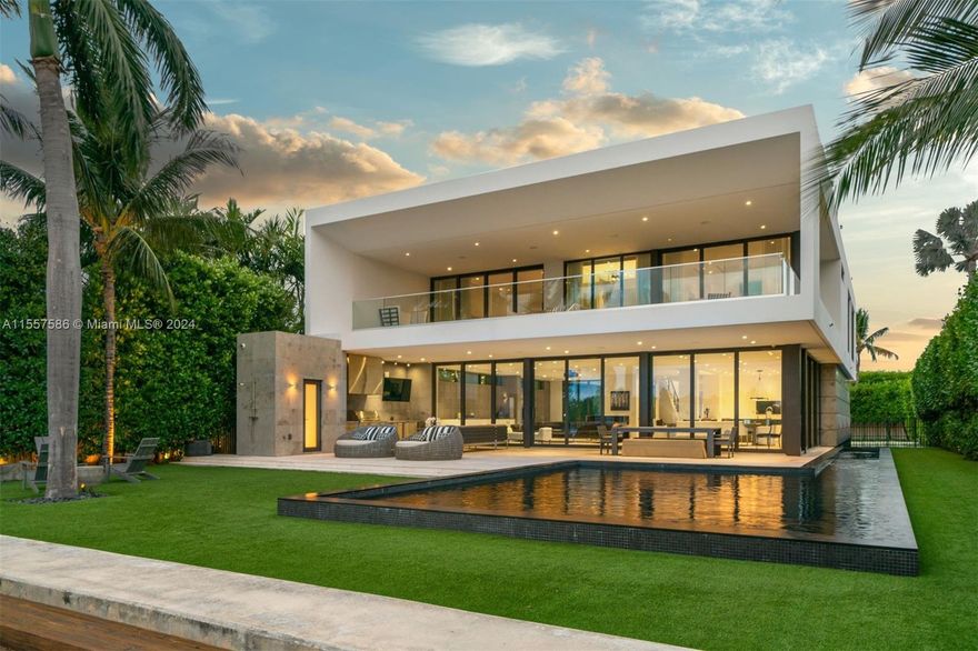 Waterfront retreat in the highly desirable Lakeview neighborhood boasts coveted southern exposure & wide, mesmerizing views of Surprise Lake. Enter through an expansive driveway. Relax by the 70-foot heated lap pool or entertain on the large outdoor terrace w/ a summer kitchen. W/ a private dock & floor-to-ceiling windows framing stunning vistas, natural light & tranquil water views are abundant in this waterfront estate. The spacious principal bedroom features a waterfront terrace, soaking tub overlooking the water, dual sinks & an expansive walk-in closet. 200+ bottle custom design wine cellar, Crestron/Lutron smart home control panels & a pneumatic elevator offer unparalleled comfort & sophistication. Enjoy the convenience of an open kitchen with Miele, Wolf & Sub-Zero appliances.