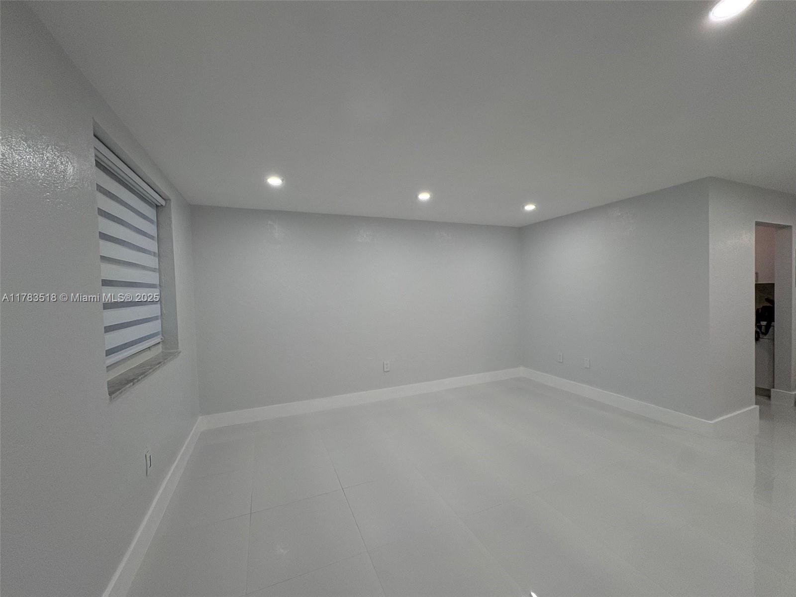 Discover this beautifully updated 1-bedroom, 1-bathroom ground-floor condo in the heart of Hialeah at Royal Palm Gardens! This bright and stylish unit features sleek ceramic tile floors, impact-resistant windows, a fully remodeled kitchen with crisp white quartz countertops, and a modern bathroom—all freshly painted with chic lighting touches. Enjoy comfort and convenience with central A/C, on-site laundry, elevator access, maintenance, water, gas, and trash included. Perfectly situated near shopping, dining, hospitals, and major highways, this is an ideal home in one of Hialeah’s most desirable areas!