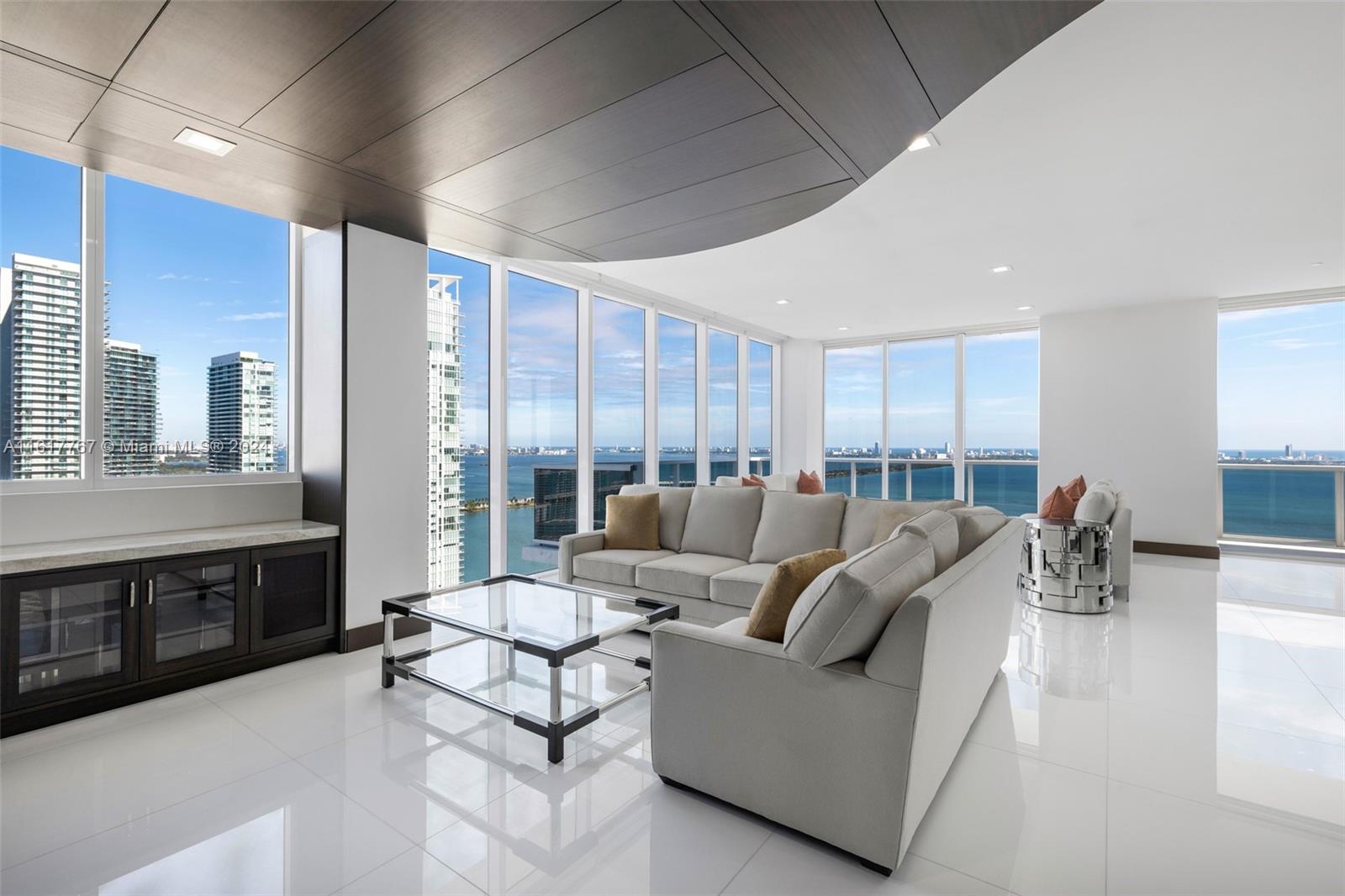 Completed remodeled two-story penthouse in the heart of East Edgewater with stunning panoramic water + city views boasting 2,832 SF of interior and a 1,512 SF rooftop plus terraces. With extreme attention to detail, this unique 4 bedroom + 5.5 bathrooms + Laundry + rooftop unit has been professionally designed and offers an expansive open floor plan with white glass tile flooring throughout and beautiful walls wrapped in wood. Custom gourmet kitchen with two large wine coolers. Featuring private elevator & foyer, high ceilings, 4 parking spaces, master suite with oversized his & her closets and his & her bathrooms, this penthouse is nothing short of luxury. Electronic blinds, Nest Thermostat, Security cameras, and much more! Boutique building complete with social room, pool, and more.