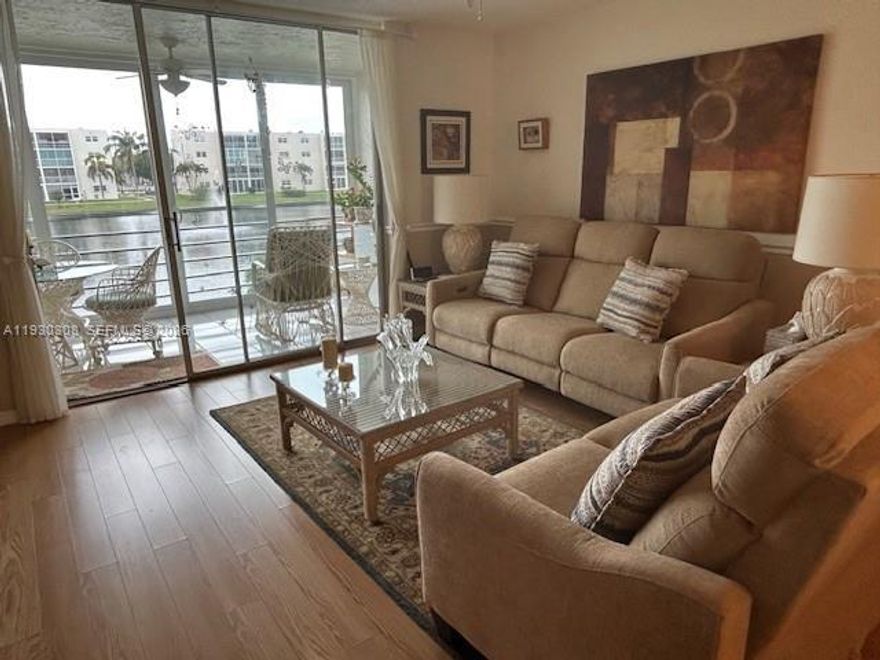 Move in ready!! Beautiful updated, impressive view of water and pool. 2 bedrooms/2-bathroom condo east of US1, Remodeled eat in kitchen, bathrooms, tile floors, storage unit, built in closets, NEW A/C, HEPA FILTER AIR & WATER PURIFIER throughout, TANKLESS water heater. Primary bedroom with an abundance of closets. New roof, new elevator, new paved parking lot, beautifully maintained community. Furniture & items included in sale. Close to Fort Lauderdale Airport, Cruise Port, walking distance to Publix, Walmart, State Parks and more. Hurricane impact sliding doors & windows, screened balcony, lake view, south exposure, heated pool, BBQ, clubhouse with activities. Assigned parking, Guest parking. NO assessments, full reserves. ALL FURNITURE AND ITEMS IN UNIT ARE INCLUDED MOVE IN READY