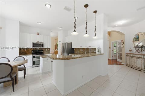 Tiny photo for 4909 NW 115th Way, Coral Springs, FL 33076 (MLS # A12029475)