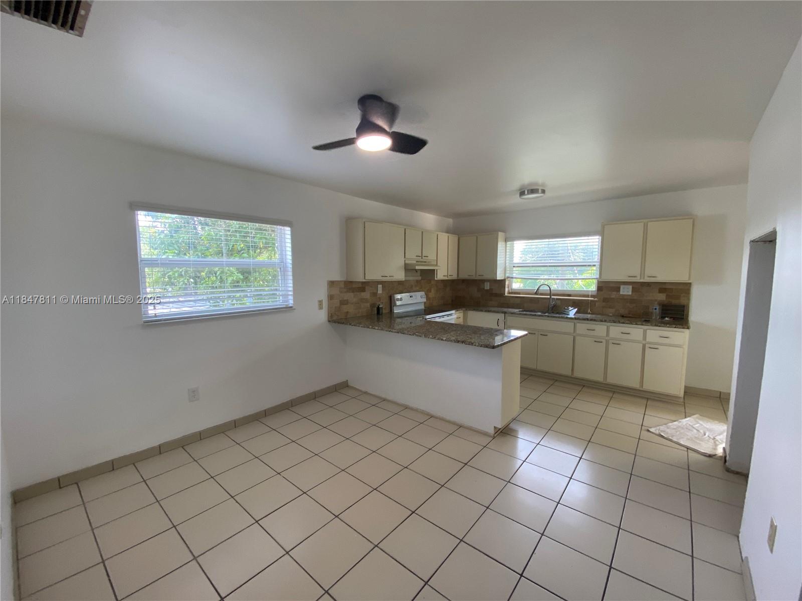 This is an apartment that feels like a single-family home. Spacious renovated 3 bed 2 bath + den apartment (+/-1,350 SF) with private entrance and Patio. All windows are impact windows. The apartment features a large kitchen, dining room, den for an office, and large living room. The bedrooms are nice and comfortable with large windows to let light in. Additionally, the apartment has a laundry room with a washer and dryer, central A/C and two balconies. The apartment has access to and use of a patio. Centric and secure location. 10 minutes from the airport. Three (4-6) parking spaces. RENT INCLUDES water, electricity, separate private internet service, trash, fumigation (pest control) and lawn care. FIRST MONTH + 6000 security deposit OR Terms Negotiable.