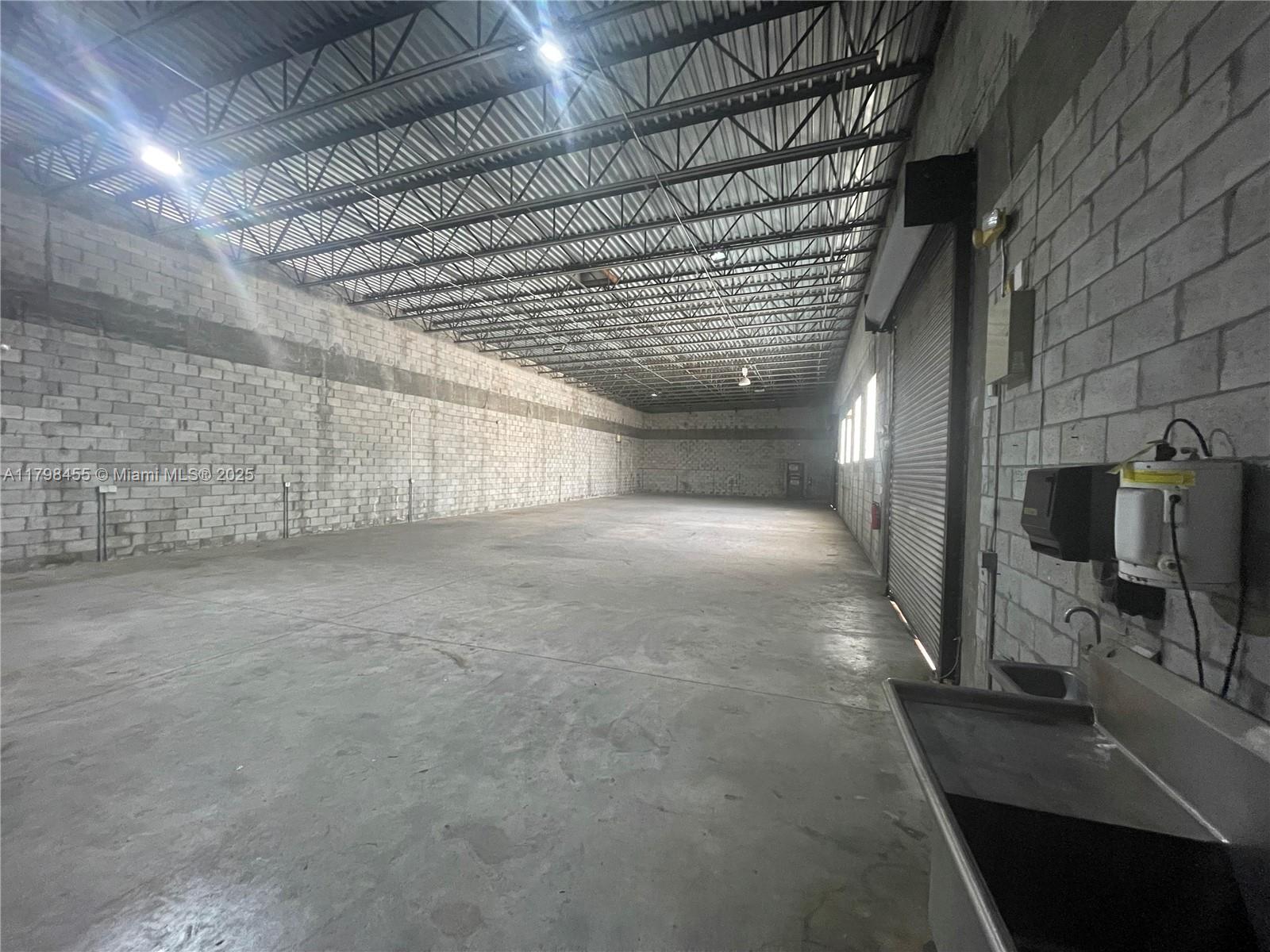 WEAR HOUSE OF ~ 4,400 SF ~ 20' CEILING HEIGHT. 2 roll up doors