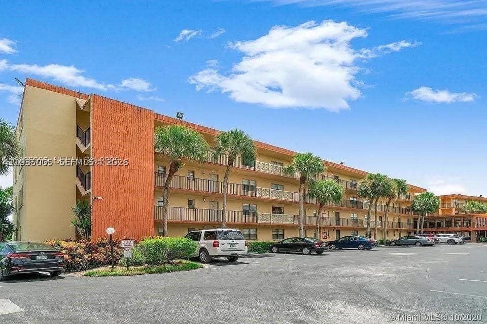 Photo of 9440 SW 8th St #402, Boca Raton, FL 33428 (MLS # A11935005)