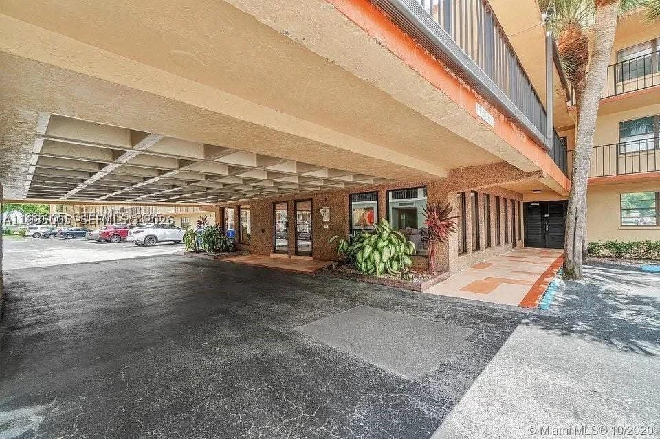 Photo of 9440 SW 8th St #402, Boca Raton, FL 33428 (MLS # A11935005)