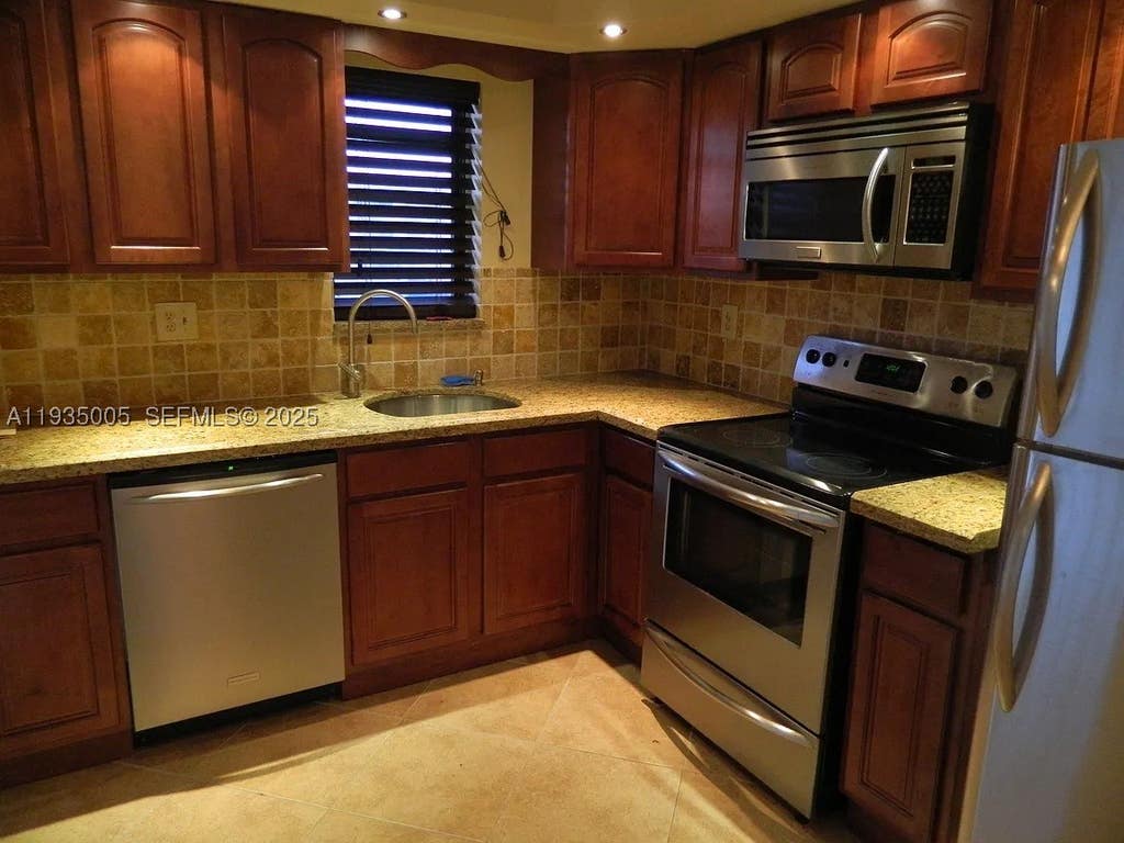 Photo of 9440 SW 8th St #402, Boca Raton, FL 33428 (MLS # A11935005)