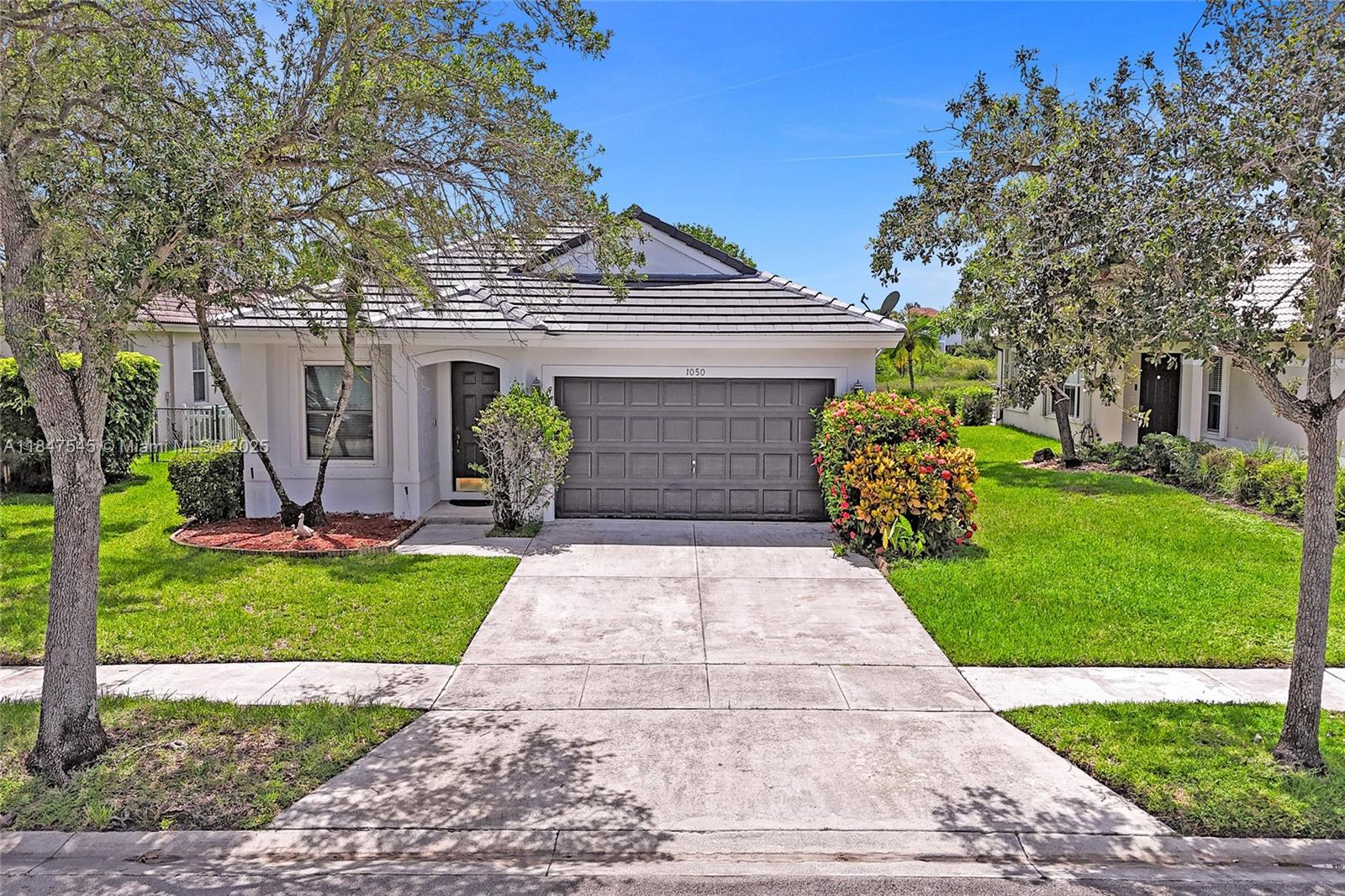 WOW! ALL OF THE MOST IMPORTANT AND MOST EXPENSIVE ITEMS HAVE BEEN TAKEN CARE OF ALREADY! BRAND NEW ROOF! (2024), NEW IMPACT GLASS WINDOWS & DOOR, NEW AC (2023), NEW WATER HEATER, NEW GARAGE DOOR LIFT MASTER (2025)! NO POPCORN CEILINGS! FRESHLY PAINTED EXTERIOR & INTERIOR. THE FLOORS, CARPET, KITCHEN & BATHROOMS ARE ORIGINAL AND READY FOR YOUR PERSONALIZED UPDATES. WATERFRONT VIEWS & NO NEIGHBORS BEHIND YOU -- JUST A PEACEFUL NATURE PRESERVE. THIS HIGHLY SOUGHT-AFTER GUARD-GATED COMMUNITY IS CLOSE TO A-RATED SCHOOLS, WORLD-CLASS SHOPPING, WHOLE FOODS, PUBLIX, RESTAURANTS, PARKS AND ALL MAJOR HIGHWAYS, 25 MINUTES TO HOLLYWOOD OR FT LAUDERDALE BEACHES.