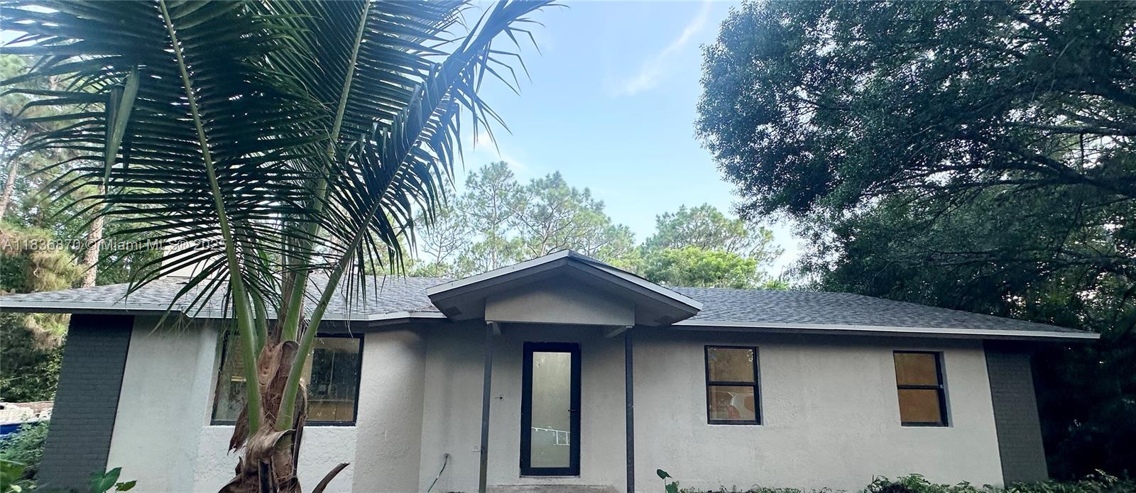 Rare find over 1 acre lot, single family home with two car garage completely rehabbed home with brand new roof, new bathrooms, new flooring throughout, impact windows, all new appliances, new ac unit, freshly painted inside and out. Extra enclosed Florida room can be used for an extra room or game room. Enjoy Nature and privacy with lots of room for entertainment or activities. NO HOA, HURRY WON'T LAST.