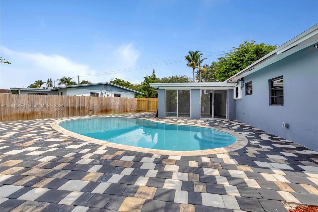 Photo of 361 NW 49th Ave, Plantation, FL 33317 (MLS # A11681247)
