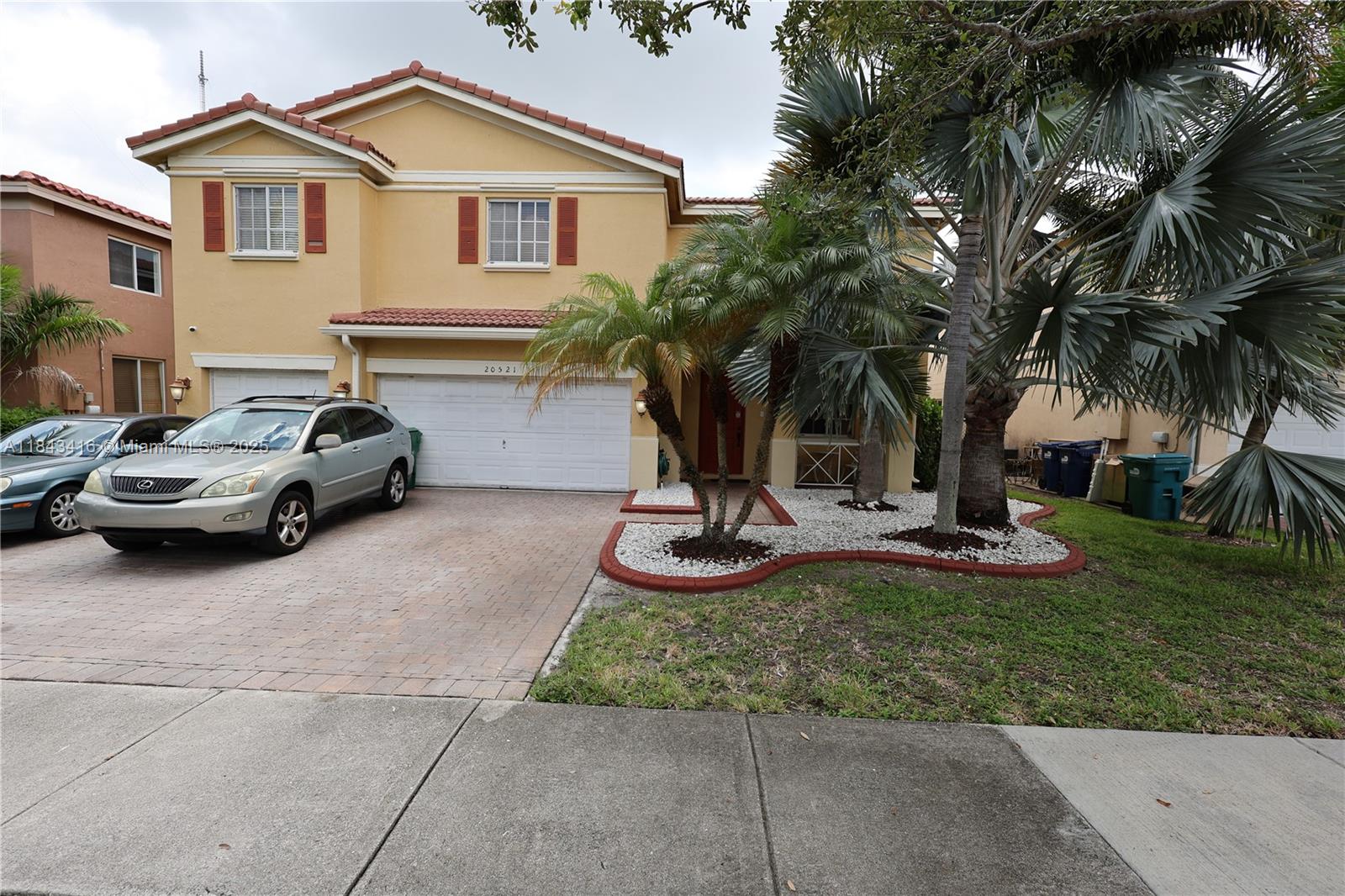 Welcome to your new home in Coconut Cay, a gated community in Miami Gardens. Stunning 5-bedroom, 4-bathroom residence offers an exceptional layout and elegant finishes. This home features a gourmet kitchen, a formal living room, specious dining and family rooms, as well as a casual eat-in kitchen area perfect for both entertaining and everyday living. Upstairs you'll find a generous master suite, while the first floor includes a junior master suite ideal for guests or multi-generational living. Additional highlights include a 3-car garage and a dual A/C units, providing flexibility. Located just 15 minutes from Aventura Mall and the iconic Hard Rock Hotel, this offers the perfect balance of luxury and location. More photos are coming. Stay-tuned!
