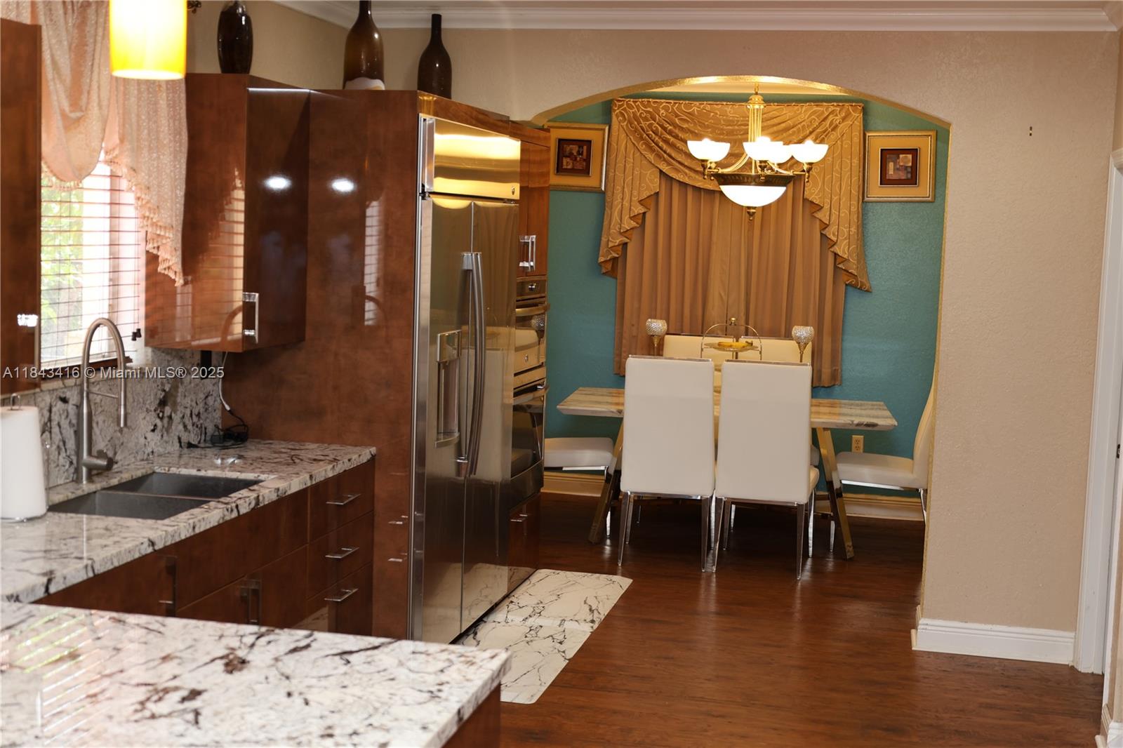 Welcome to your new home in Coconut Cay, a gated community in Miami Gardens. Stunning 5-bedroom, 4-bathroom residence offers an exceptional layout and elegant finishes. This home features a gourmet kitchen, a formal living room, specious dining and family rooms, as well as a casual eat-in kitchen area perfect for both entertaining and everyday living. Upstairs you'll find a generous master suite, while the first floor includes a junior master suite ideal for guests or multi-generational living. Additional highlights include a 3-car garage and a dual A/C units, providing flexibility. Located just 15 minutes from Aventura Mall and the iconic Hard Rock Hotel, this offers the perfect balance of luxury and location. More photos are coming. Stay-tuned!