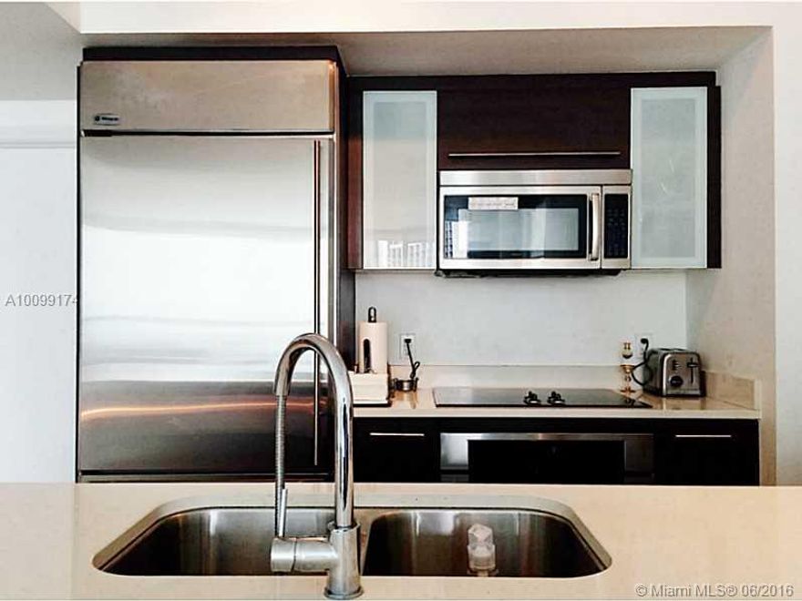 VACANT!! 100% repainted, upgraded & desired East Tower Corner Unit w/ a beautiful day/night downtown and water view and Brickell Ave./Whole Foods/Brickell City Centre/Train at your fingertips. Luxury Ceramic floors, walk-in closets, STAINLESS STEEL appliances, NEWER washer/dryer, large master suite, & more. Building has an incredible GYM, rooftop pool, mid-level pool w/ day beds, theater, wine/cigar room, clubroom w/ pool table/bar/TVs, resident lounge, hot tubs, & more. Basic Cable/Internet Included