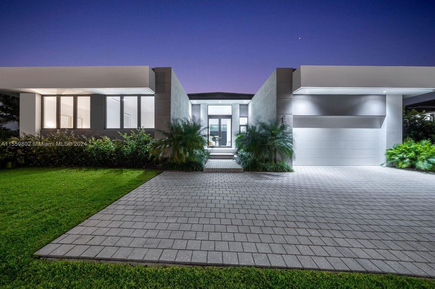 Exciting News! One of the ONLY SINGLE STORY NEW CONSTRUCTION HOMES ON THE MARKET! Immerse yourself in luxury at this pristine waterfront oasis! This contemporary gem offers over 5600 sqft of modern living space, featuring 5 bedrooms, a sleek office, and 7 lavish bathrooms. Highlights include soaring 14-foot ceilings, a gourmet MiaCucina kitchen with a gas Wolf range, and an oversized SubZero refrigerator. The expansive 2-car garage accommodates car lifts for 4 vehicles. Enjoy seamless indoor-outdoor living with impact doors opening to over 600 sqft of covered terrace, perfect for entertaining. Boating enthusiasts will appreciate the nearly 100ft of ocean access waterway and a brand new 50-foot dock. Walk to houses of worship and the exclusive Shell Bay Club, offering world-class amenities.