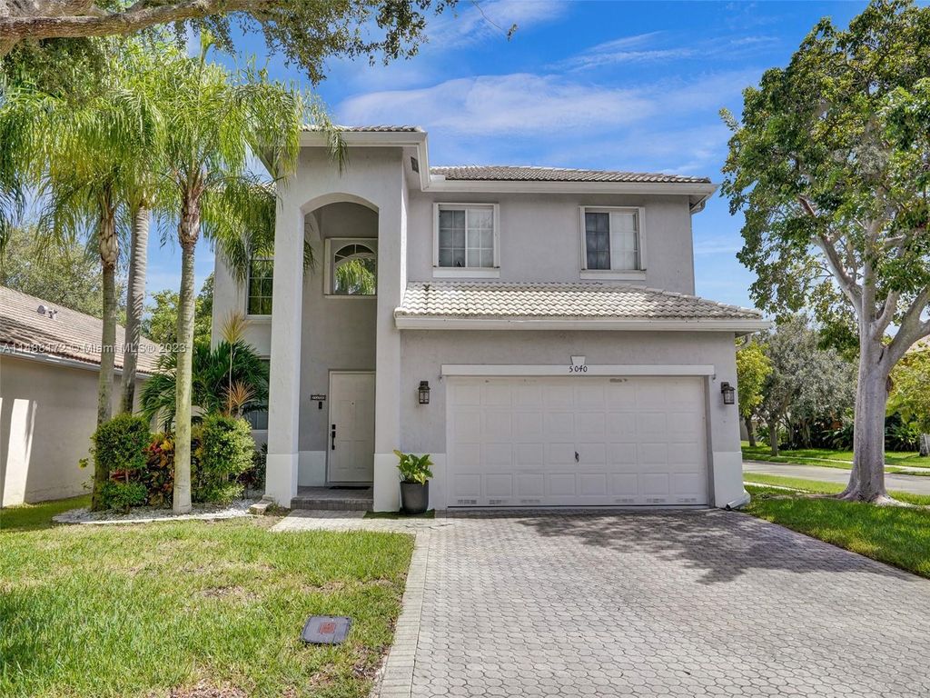 Photo of 5040 Heron Pl, Coconut Creek, FL 33073 (MLS # A11488172)