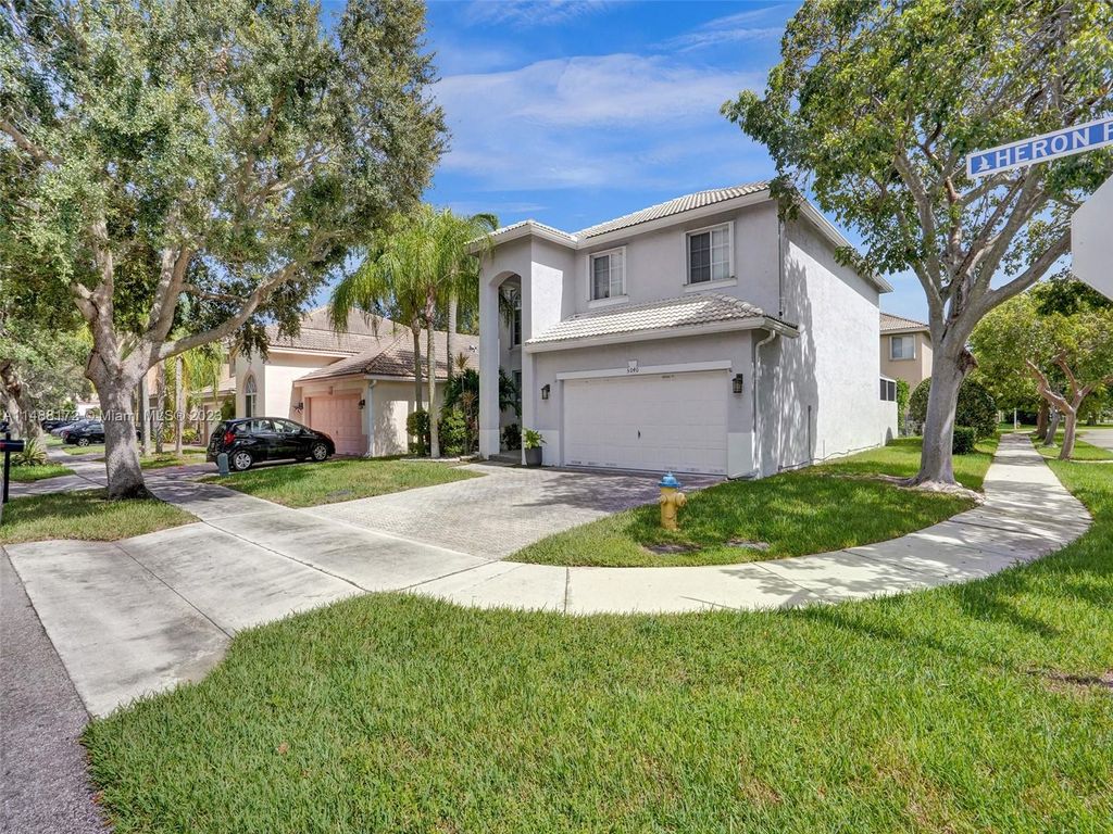 Photo of 5040 Heron Pl, Coconut Creek, FL 33073 (MLS # A11488172)