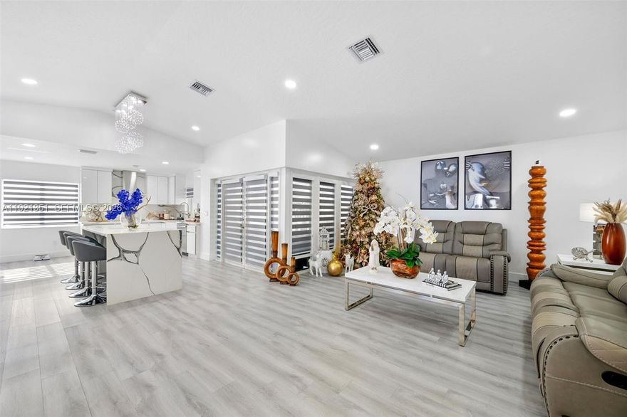 NO FLOOD ZONE, NO HOA, NO CDD. Buyer concessions available! Beautifully upgraded 4-bedroom, 3-bathroom home, plus DEN, laundry room, private studio that generates income, pool, outdoor kitchen, whole-house generator, well water for irrigation, and car wash. 2022 UPGRADES include: electrical panel, plumbing, HVAC, water heater, impact windows/doors, and vinyl flooring. Modern kitchen with quartz countertops and aesthetic bathrooms. All bedrooms feature custom built-in closets. Maximize South Florida lifestyle with an outdoor fully equipped kitchen (gas cooktop + full-size refrigerator), saltwater pool (above-ground) with a brand-new deck, privacy hedges, and a professionally installed whole-house generator, and a new well motor and water tank - storm ready! Oversized modern driveway that fits 8+ cars, BOAT, or RV. 2018 Roof. 2023 Solar panels are owned and financed through GoodLeap (not PACE), with a 25-year warranty. Studio with a private entrance that generates income. Minutes from Turnpike (exit 6), top schools, shopping, restaurants, and more.