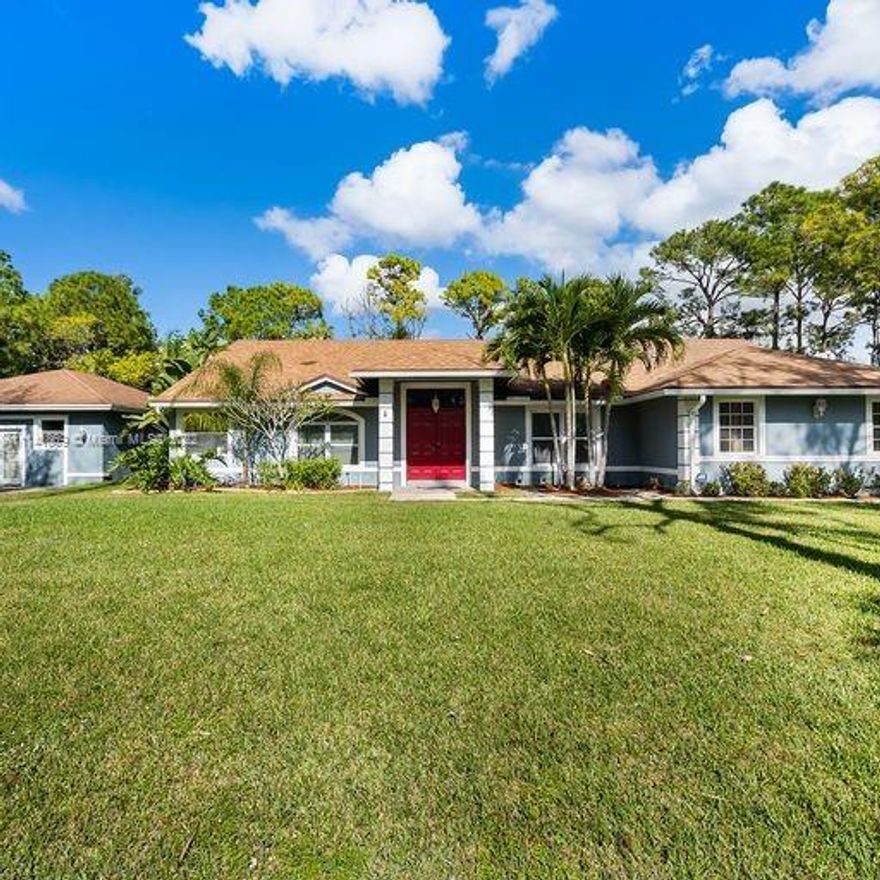 Gorgeous 4/3/2 Home with Guest House 2/1 with Full Kitchen and Family Room with Heated Pool all situated on 1.28 acres in the Beautiful Community of Loxahatchee.  This home features a heated pool,  vaulted and volume ceilings, new roof, tankless water heater, reverse osmosis water system, electric gated entry, granite kitchen, wood burning fireplace, ProTran generator hookup, ceramic tile, hot tub, outdoor kitchen, cabana bath and so much more.  The main house is 2451 under air and the guest house is an additional 900 under air and is perfect for a  guest suite or even as an additional rental property since it is not attached to the main residence.  No HOA or restrictions so bring your RV's, boats or toys to enjoy this amazing space.   Additional storage building 10X15 or add workshop!