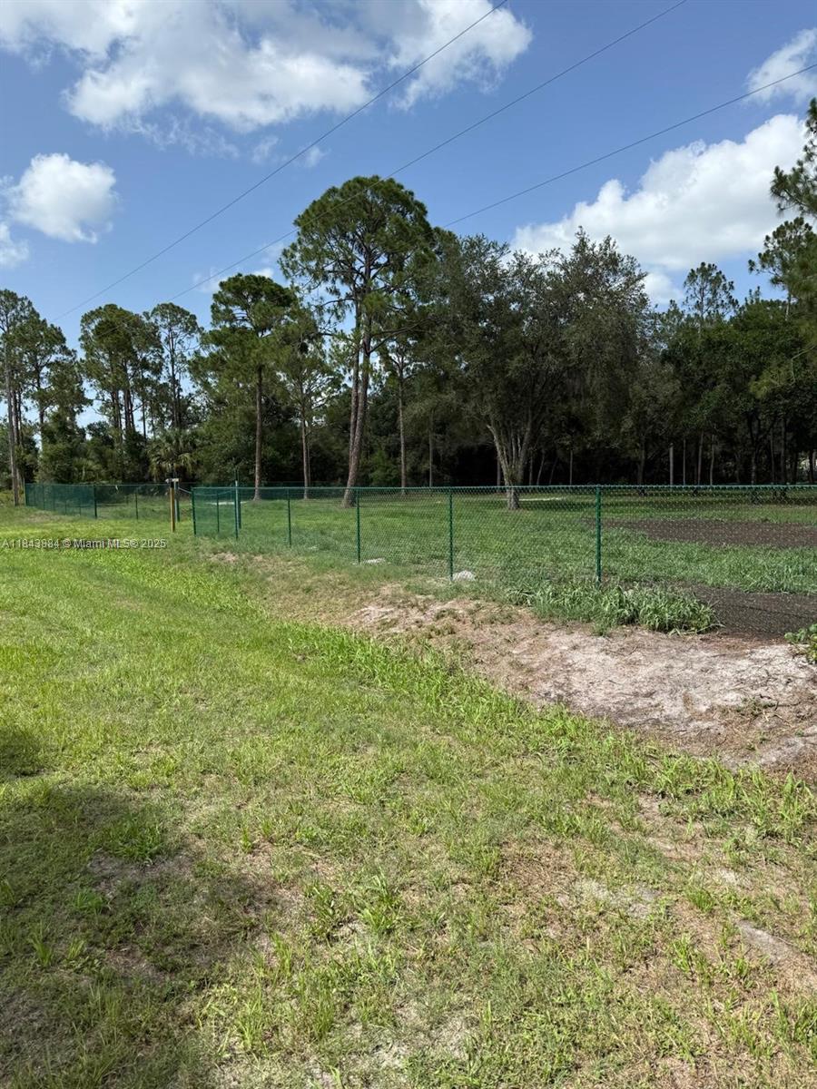 Beautifully maintained and cleared lot in Montura Ranch Estates. Lot is fully fenced in with permits as well as the entryway to the lot. The lot includes Drawings for a 2500sqft Barndominium as well as the deposit in the amount of $16,000.00 which has already been paid. The total cost of the Barndominium is $43,000.00 which means only $27,000.00 would have to be paid if you choose to move forward with the building. There is also a fully fenced in dog pen, a separate fenced in animal pen, and metal chicken cages. Great location, no flooding, and paved roadways to N Lindero St. Do not miss out on this opportunity!