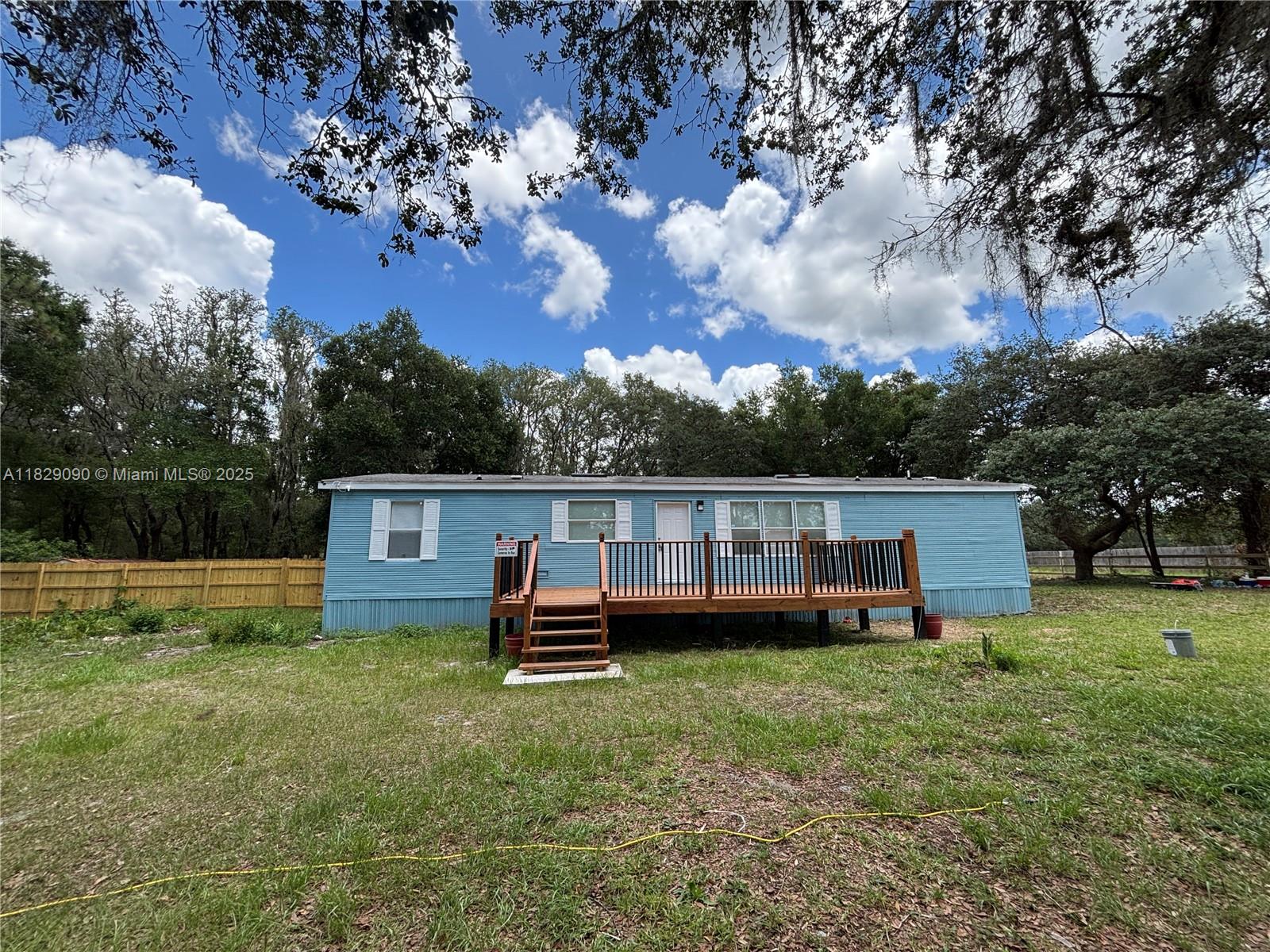 Welcome to peaceful country living! This well-maintained and move-in-ready 3-bedroom, 2-bath manufactured home sits on a generous 3.23-acre lot, zoned A1. Step inside to find brand-new flooring, and a bright, open floor plan. The home is being sold as-is, and includes new furniture and several recent upgrades. The bathrooms have been thoughtfully renovated with new sinks, showers, toilets, and fixtures—bringing a fresh, modern feel to the space. Enjoy the outdoors from two spacious, updated decks in the front and back. This property combines the best of rural charm with modern updates, and with A1 zoning, it provides flexibility for a variety of uses—whether you're dreaming of starting a small farm, building a workshop, or just having room to roam.