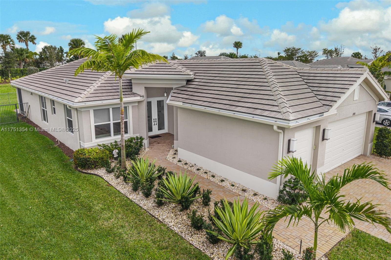 Experience the elegance of the Palazzo model in Valencia Grove, Riverland’s shining star! This stunning 3-bedroom, 2.5-bathroom home spans 2,157 a/c sq. ft. with a Den/Opt. 4th bedroom & Great Room across 3,088 total sq. ft. Over $100K in luxury upgrades enhance the gourmet kitchen with high-end LG appliances, quartz countertops, and custom cabinetry. Soaring 9’2”-10’2” ceilings, recessed lighting, and elegant tile flooring add sophistication. The oversized primary suite features a luxury oasis bathroom. Enjoy the private fenced backyard with a water feature, screened porch, and extended patio. A 2-car garage with EV charging & Golf Cart storage completes this masterpiece. Your dream home awaits!