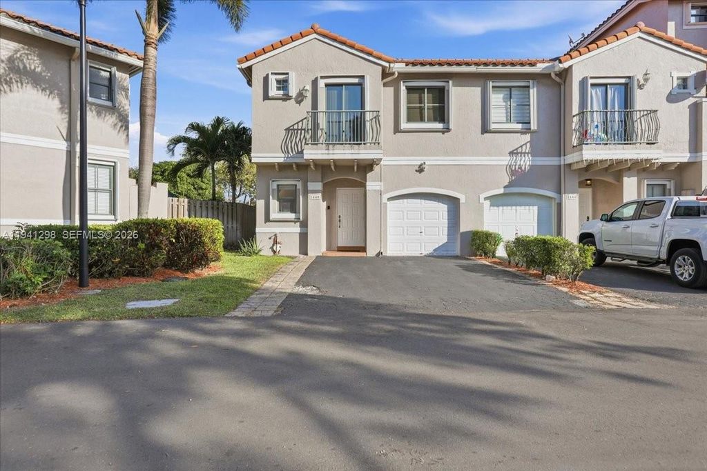 Photo of 1448 NW 126th Ave, Sunrise, FL 33323 (MLS # A11941298)