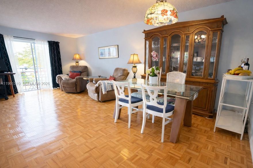 Bright, move-in ready DELUXE 1-bedroom, 1-bath residence with central AC offered fully furnished. The home features a spacious open layout with beautiful parquet flooring throughout and natural light in every room. The living and dining area flows seamlessly, offering generous space for both relaxing and entertaining. The space feels warm, inviting, and well cared. Large sliding glass doors lead to a screened balcony—perfect for morning coffee or evening relaxation—while bringing in fresh air and sunshine.
The kitchen equipped with a band new dishwasher, microwave, refrigerator, and electric range. The bedroom is well-sized and bright, offering a peaceful retreat with plenty of room for storage and comfort. Located in Mar-Len Gardens, a gated 55+ community in North Miami Beach, residents enjoy a vibrant lifestyle with amenities including two heated pools, fitness area, library, billiards room and sauna. Maintenance fees include insurance, water, basic cable, and more. Conveniently close to public transportation, airports, shopping, and just minutes from the beach.
Vacant, easy to show, and truly turnkey. Schedule your private showing today.