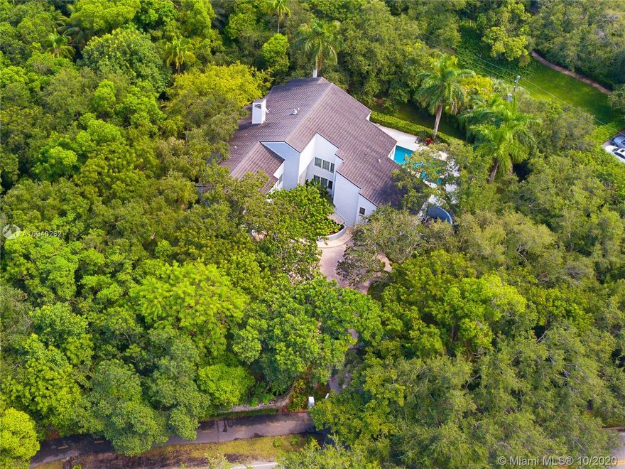 Remarkable Gables Estates property on 1.4 acres with amazing oaks and lovely gardens. Contemporary style home with spacious rooms all offering views of the lush gardens and towering oaks.  Renovated kitchen with top of the line appliances, large master suite with his and her baths, split bedroom floor plan with all bedrooms on the second floor and two beautiful decks that wraps around the first floor. A relaxing and peaceful abode for anyone.