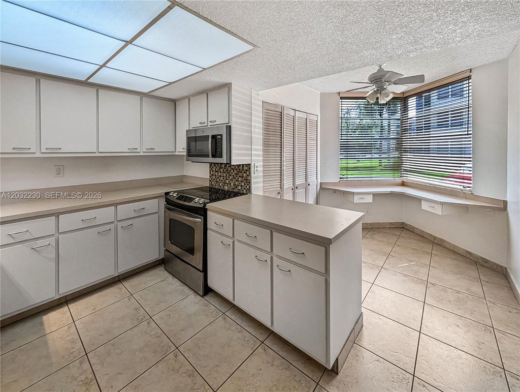 Photo of 9531 Seagrape Dr #108, Davie, FL 33324 (MLS # A12032230)