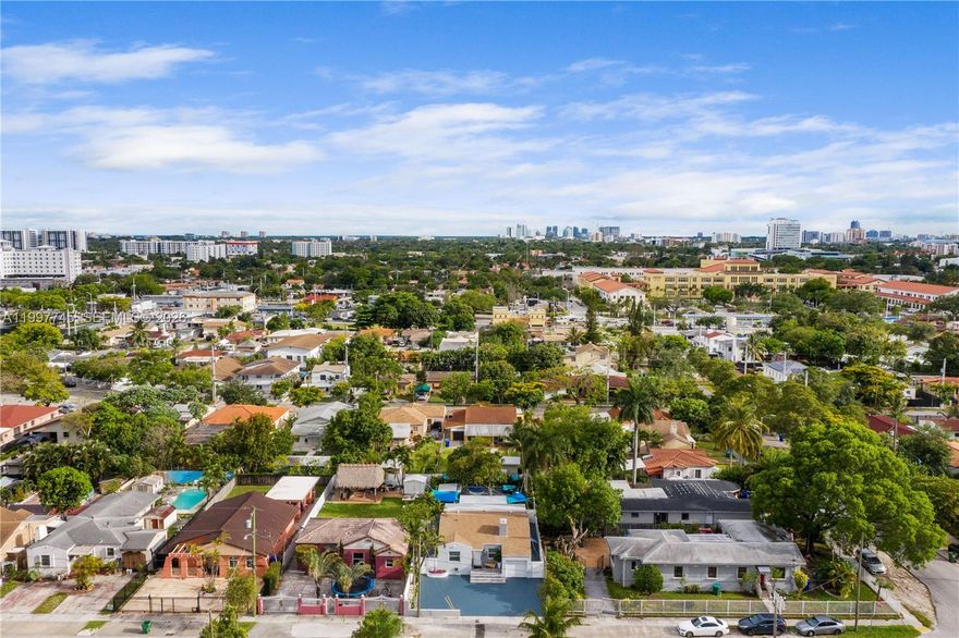 Spectacular single-family home or turnkey income-producing property combining luxury, flexibility, and strong income potential. Fully remodeled 5BD/4BA single-family home legally operating as a high-performing Airbnb, sold fully furnished and fully equipped with active bookings generating $130K+ annually. Proven income with future upside. Property was completely gutted and upgraded: new foundation work, plumbing, electrical (new panel), walls, ceilings, brand-new 2025 metal roof (40-year warranty), new A/C, impact windows, and modern kitchen and bathrooms. Flexible layout with multiple master suites and private entrances, ideal for short-term rental or multi-use living. Outdoor features include covered terrace, outdoor kitchen, deck with hot tub, two mango trees, laundry/storage room, concrete driveway, and fully fenced yard with automatic gate. Turnkey operation with virtual front desk and established management system in place. Previously rented long-term for $7,000/month. Prime Little Havana location just minutes to Brickell, Downtown Miami, Miami International Airport, and major attractions. Perfect for investors or end-users seeking income and lifestyle. Easy to show. Text listing agent or co-listing agent, or use showing request.