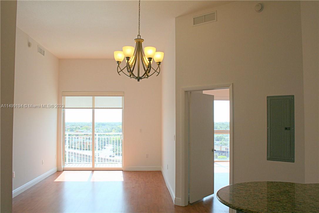Tenant Occupied till FEB 2024 (BUT CAN LEAVE BEFORE). TOP FLOOR UNIT in the heart of Downtown Dadeland offers a sophisticated living experience. Features split bedroom layout with laminated wood flooring, lofty high ceilings, and convenient walk-in closets. The kitchen boasts granite countertops, wood cabinetry, and modern stainless steel appliances. Enjoy the convenience of having a washer and dryer inside the unit. Situated within walking distance of diverse dining options, shopping centers, and the Metrorail, this residence combines comfort, style, and accessibility for a truly desirable living arrangement.