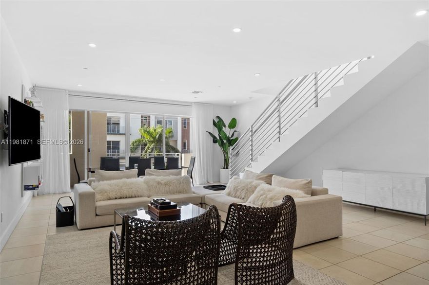 Modern 3-bedroom, 3.5-bath loft-style townhome in Galleria Lofts, located in the desirable Lake Ridge area of Fort Lauderdale. Spacious layout with approximately 1,938 sq ft of living space, high ceilings, open-concept living and dining area, and contemporary finishes throughout. Features include ceramic floors, covered and assigned parking, and abundant natural light. Conveniently located minutes from Fort Lauderdale Beach, The Galleria Mall, shopping, dining, and major highways. Ideal for buyers seeking modern design in a prime location.