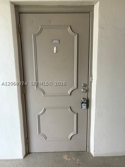 Photo of 9440 Poinciana Pl #404, Davie, FL 33324 (MLS # A12068974)
