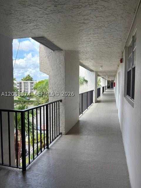 Photo of 9440 Poinciana Pl #404, Davie, FL 33324 (MLS # A12068974)