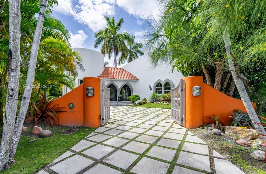 Nestled in the heart of South Miami, this Mediterranean gem is a true architectural masterpiece designed by architect Jose Anthony Enriquez. This one-of-a-kind home stands out in the community with its unique design and exquisite craftsmanship. Every door is handmade from wood, adding a touch of artisanal elegance. The grand vaulted ceilings are adorned with hand-stamped wood beam accents, evoking the grandeur of a majestic palace. The polished cement flooring throughout enhances the home's modern yet timeless appeal. This home is not just a place to live, but a work of art that exudes luxury and sophistication. The newly updated white exterior enhances curb appeal and highlights the home’s distinctive lines. Ideal as a private residence or a high-performing short-term rental investment. Some photos have been virtually staged.