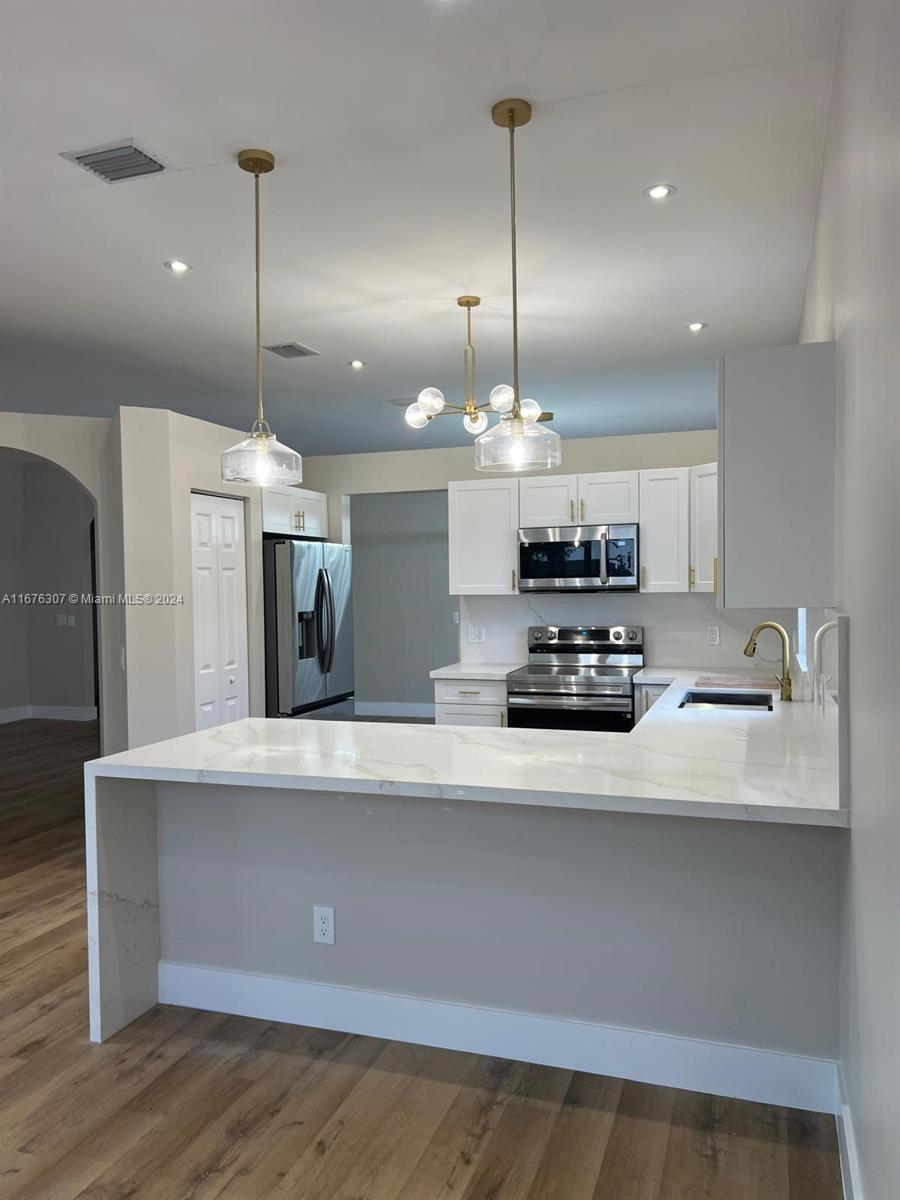 Welcome to this gorgeous, spacious 3-bedroom, 2.5-bathroom single-story home with a large 2-car garage. Located in the prestigious, gated community of Vizcaya in West Miramar, this home offers access to excellent A+ schools, nearby shopping, dining, and major highways. Enjoy the community amenities including a clubhouse, pool, and kids' play area, all with a very low HOA fee. The home has been totally renovated!