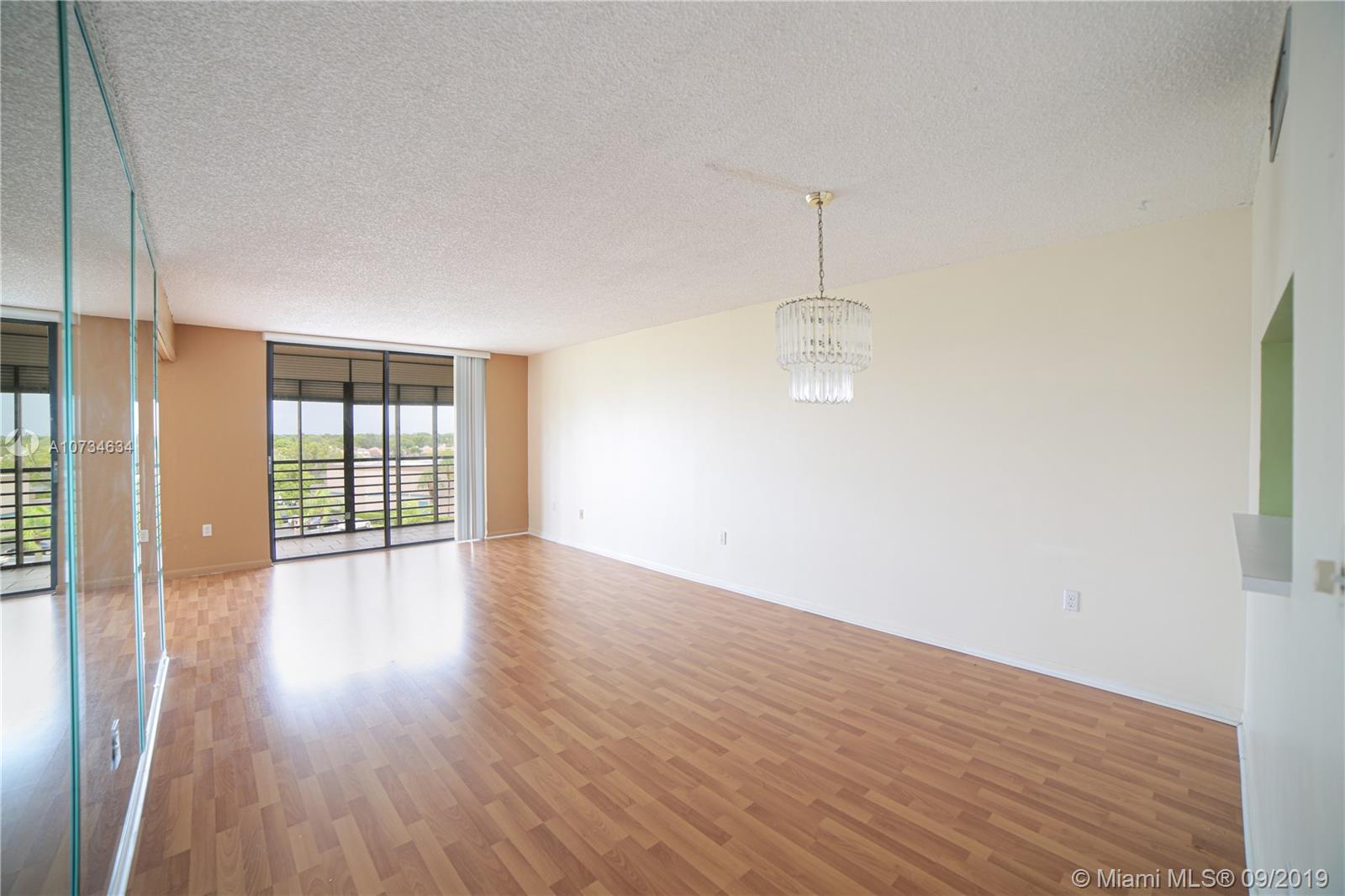 Great opportunity to own BEST-PRICED unit in Colony Point! This top floor 1 bed/2 bath unit can easily be converted into a 2 bed/2bath. Residence includes spacious split bdrm layout w/laminate floors in main living areas, stackable washer/dryer, pull-down shutters in balcony, walk-in closet, & addtl storage. COLONY POINT is an adult 55+ gated community located in the heart of Pembroke Pines & near Memorial Hosptial. Community sits on 37 acres of prime, tree-laden real estate & is surrounded by beautiful lakes. Recreational amenities include: clubhouse, fitness room, multipurpose room, billiard room, theater, crafts room, card rooms, Jacuzzi, saunas, an outdoor heated pool, tennis courts, racquetball & shuffleboard courts & courtesy bus svc 
Assoc req 20% dwn, no pets, & no leasing.